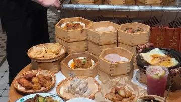 Assorted Cantonese dim sum and local dishes served in bamboo steamers and baskets
