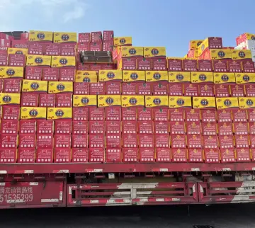 Truck bed filled with red and yellow retail cartons prepared for bulk dried goods transport
